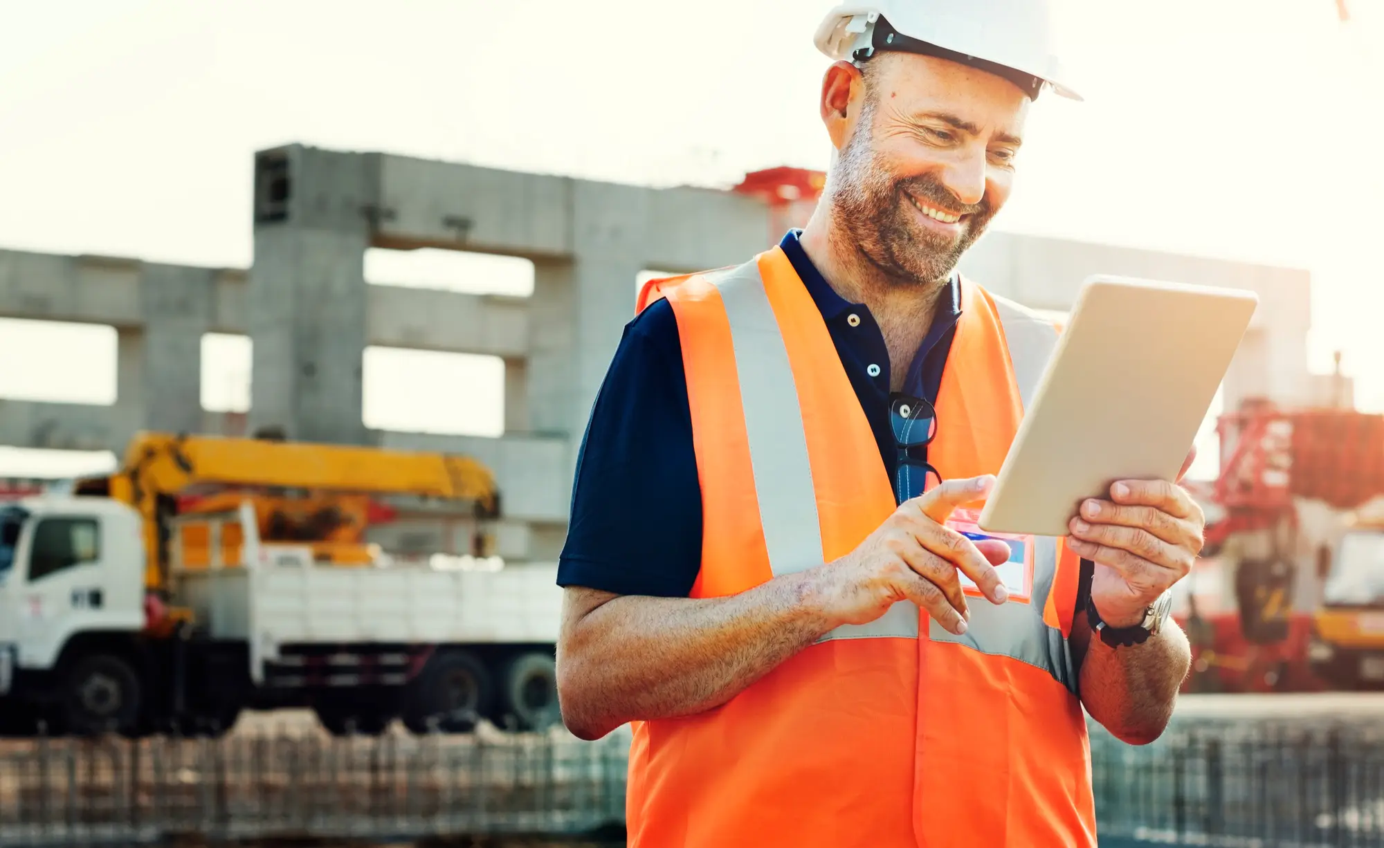 Construction worker using tablet on site
